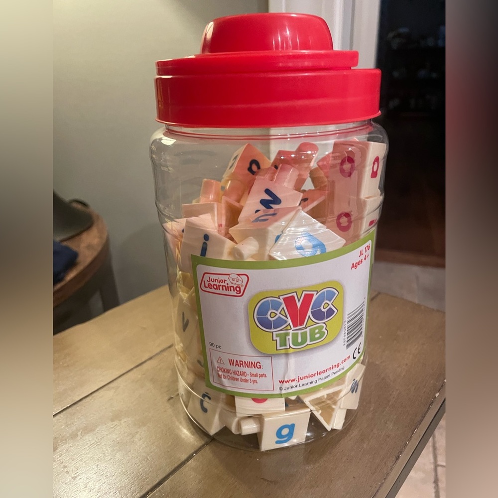 Kids learning toy - tub of connectable letters.